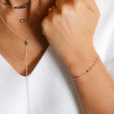 Black Diamonds Eye-Shaped Necklace with a White Diamond