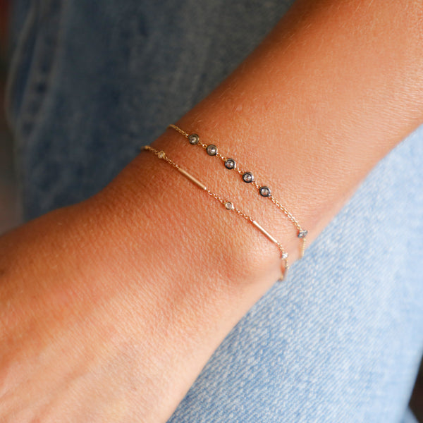 Bracelet with Six White Diamonds and Gold Bars.