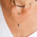 Black Diamonds Eye-Shaped Necklace with a White Diamond