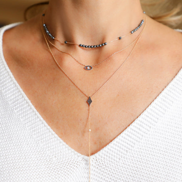 Black Diamonds Eye-Shaped Necklace with a White Diamond